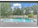 Beautiful screened-in pool with water feature is surrounded by lush landscaping offering the ultimate in privacy and relaxation at 2812 Windcrest Oaks Ct, Valrico, FL 33594