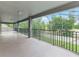 Enjoy outdoor living on this spacious screened porch, perfect for relaxing and entertaining with views of the yard at 2812 Windcrest Oaks Ct, Valrico, FL 33594