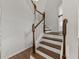 Elegant staircase featuring wood treads, white risers, and a wood and white balustrade at 2812 Windcrest Oaks Ct, Valrico, FL 33594