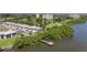 Beautiful waterfront living featuring a community dock, lush trees, and views of the gulf coast at 2980 Haines Bayshore Rd # 105, Clearwater, FL 33760