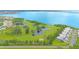 Scenic aerial view showcases the golf course, ponds, and waterfront location at 2980 Haines Bayshore Rd # 105, Clearwater, FL 33760