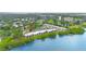Aerial view of waterfront community with lush landscaping and water views at 2980 Haines Bayshore Rd # 105, Clearwater, FL 33760