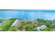 Panoramic aerial view of waterfront community, golf course, and bay at 2980 Haines Bayshore Rd # 105, Clearwater, FL 33760