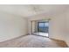 Spacious bedroom with sliding glass doors to a balcony and beautiful water views at 2980 Haines Bayshore Rd # 105, Clearwater, FL 33760