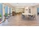 Spacious room that serves as the community clubhouse featuring beach mural at 2980 Haines Bayshore Rd # 105, Clearwater, FL 33760