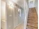 Hallway leads to a staircase and bathroom, enhancing the home's layout at 2980 Haines Bayshore Rd # 105, Clearwater, FL 33760