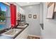 Community kitchenette featuring stainless steel microwave, toaster oven, sink, and mini-fridge at 2980 Haines Bayshore Rd # 105, Clearwater, FL 33760