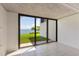 Enclosed lanai featuring sliding glass doors and scenic views of the waterfront at 2980 Haines Bayshore Rd # 105, Clearwater, FL 33760
