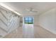 Bright, airy living room featuring neutral tile floors and scenic water view at 2980 Haines Bayshore Rd # 105, Clearwater, FL 33760