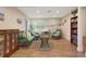 Relaxing community clubhouse with ample seating, beach mural, and decor at 2980 Haines Bayshore Rd # 105, Clearwater, FL 33760
