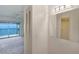Living room with water view balcony, closet, and neutral walls at 2980 Haines Bayshore Rd # 105, Clearwater, FL 33760