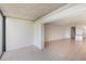 A well-lit living room has tile flooring and stairs leading to the second floor at 2980 Haines Bayshore Rd # 105, Clearwater, FL 33760