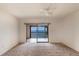 A bedroom with carpet floors has water views from its private balcony at 2980 Haines Bayshore Rd # 105, Clearwater, FL 33760