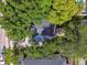 Overhead aerial view of the backyard with a view of the deck and lush landscaping at 3127 W Oakellar Ave, Tampa, FL 33611
