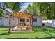 Cozy backyard with a pergola-covered patio, outdoor furniture, and a grill at 3127 W Oakellar Ave, Tampa, FL 33611