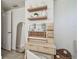 Bright bathroom featuring a vanity, decorative shelves, and a large mirror at 3127 W Oakellar Ave, Tampa, FL 33611