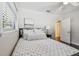 This bright bedroom features hardwood floors, large windows, and natural light at 3127 W Oakellar Ave, Tampa, FL 33611