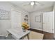 Bright bedroom with a desk, neutral decor, and two closets at 3127 W Oakellar Ave, Tampa, FL 33611