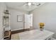 Inviting bedroom featuring wooden floors, desk, and neutral decor at 3127 W Oakellar Ave, Tampa, FL 33611