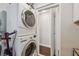 Laundry area with stackable washer and dryer, located near a closet at 3127 W Oakellar Ave, Tampa, FL 33611