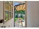 Inviting outdoor patio area with seating, a pergola, and lush landscaping at 3127 W Oakellar Ave, Tampa, FL 33611