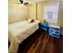 Comfortable bedroom featuring hardwood floors, neutral walls, and natural light from the window at 3135 33Rd N Ave, St Petersburg, FL 33713