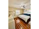 Sunlit bedroom boasts a queen-sized bed, wood floors, and tranquil decor, creating a restful atmosphere at 3135 33Rd N Ave, St Petersburg, FL 33713