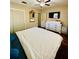 Bedroom featuring a comfortable bed, a dresser, wood floors, and ample natural light at 3135 33Rd N Ave, St Petersburg, FL 33713