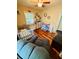 Well-lit Bedroom boasts wood floors, a crib, a comfortable recliner, and cheerful decor at 3135 33Rd N Ave, St Petersburg, FL 33713