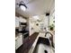 Open kitchen with stainless steel appliances, granite counters, and access to the hallway at 3135 33Rd N Ave, St Petersburg, FL 33713