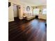 Inviting living room with wood floors, a comfortable sofa, and natural light streaming in through the windows at 3135 33Rd N Ave, St Petersburg, FL 33713
