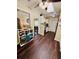 Living space highlighting dark floors, neutral walls, with living area and kitchen access at 3135 33Rd N Ave, St Petersburg, FL 33713
