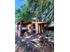 Backyard outbuilding with deck, grill, and chairs at 3135 33Rd N Ave, St Petersburg, FL 33713