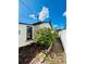 Side yard with bush and fence at 3135 33Rd N Ave, St Petersburg, FL 33713