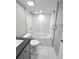 Bright bathroom features a glass-enclosed shower/tub with tile surround at 3325 Bayshore Blvd # C14, Tampa, FL 33629
