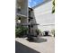 Courtyard with a black table and chair set and a grill in the background at 3325 Bayshore Blvd # C14, Tampa, FL 33629