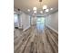 Spacious living room featuring wood floors, recessed lighting, and sliding glass doors to the lanai at 3325 Bayshore Blvd # C14, Tampa, FL 33629