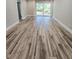 Spacious living room with wood-look flooring and access to the outdoors at 3325 Bayshore Blvd # C14, Tampa, FL 33629