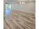 Bright living room featuring beautiful wood-look floors and recessed lighting at 3325 Bayshore Blvd # C14, Tampa, FL 33629