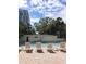 Community pool with lounge chairs and building in the background at 3325 Bayshore Blvd # C14, Tampa, FL 33629