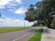 Scenic view of a road lined with lush greenery and stunning waterfront views at 3325 Bayshore Blvd # C14, Tampa, FL 33629
