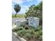Bayshore Trace Condominium sign amid lush, manicured landscaping at 3325 Bayshore Blvd # C14, Tampa, FL 33629
