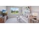 Bright living room showcasing a comfortable sofa, stylish tables, and a scenic window view at 3343 Ivy Hollow Dr, Plant City, FL 33565