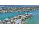 Stunning aerial view of waterfront home with private dock and serene water views at 340 Bay Plaza, Treasure Island, FL 33706