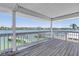 Covered balcony with views of the docks and boats on the water at 340 Bay Plaza, Treasure Island, FL 33706
