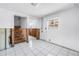 Unfinished basement area with tile flooring, stairs, and a window at 340 Bay Plaza, Treasure Island, FL 33706
