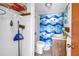 Bathroom with a themed shower curtain with storage shelving and a vanity at 340 Bay Plaza, Treasure Island, FL 33706