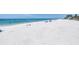 Picturesque beach view featuring white sands and calm waters on a sunny day at 340 Bay Plaza, Treasure Island, FL 33706