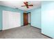 Bedroom with carpet floors, ceiling fan and closet at 340 Bay Plaza, Treasure Island, FL 33706