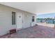 Charming covered patio with brick pavers and dock, perfect for relaxing and enjoying waterfront views at 340 Bay Plaza, Treasure Island, FL 33706